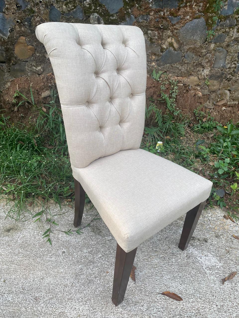 Elegant dining chair crafted from mocha-stained teak with sustainable design