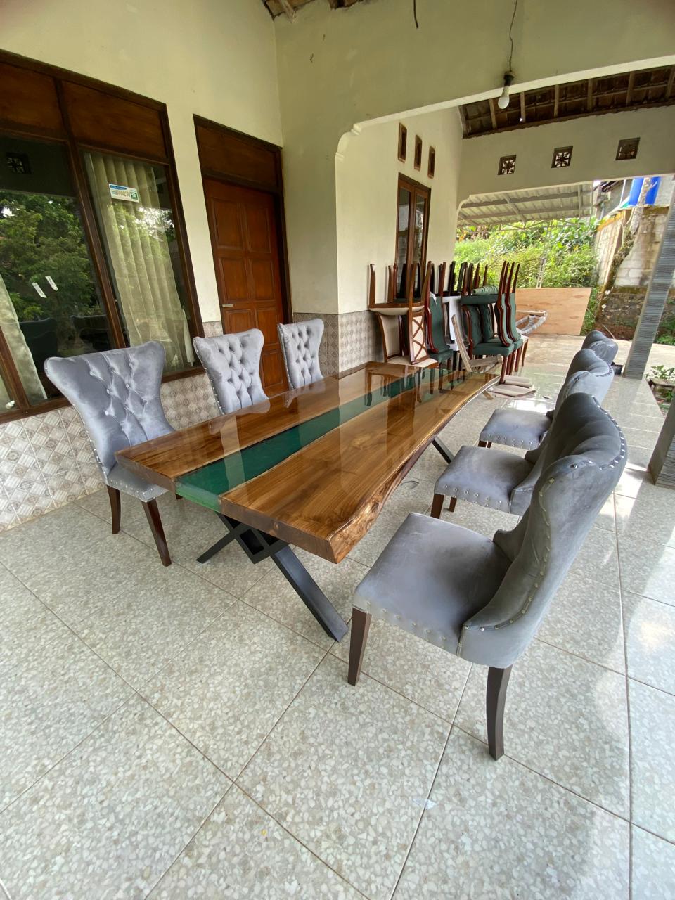 Handcrafted artisan dining table featuring jade green resin stream and natural teakwood grain
