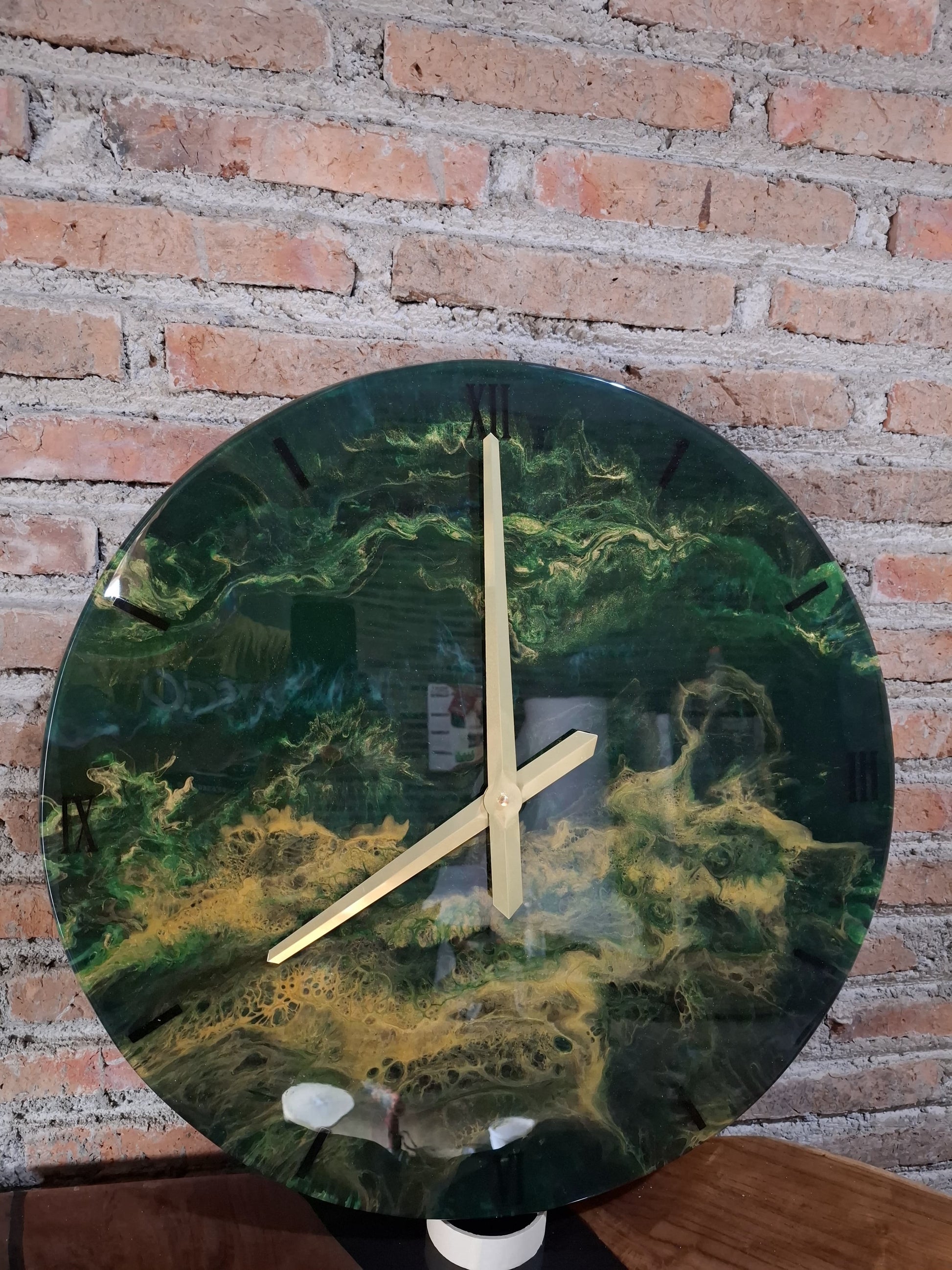 Luxury artisan Suarwood wall clock featuring vibrant emerald green resin design