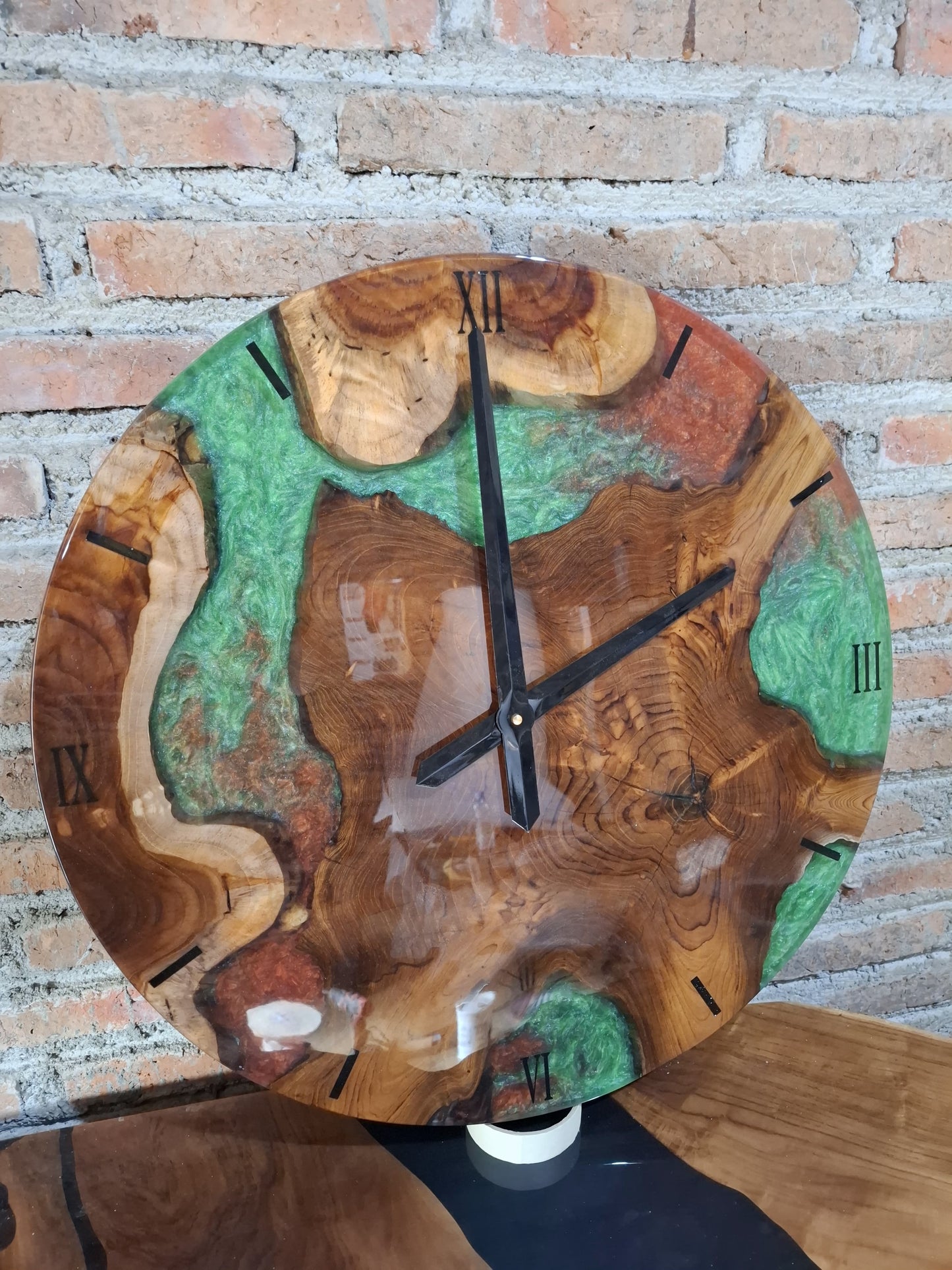 Eco-friendly wooden wall clock with emerald green resin detail and natural wood grain