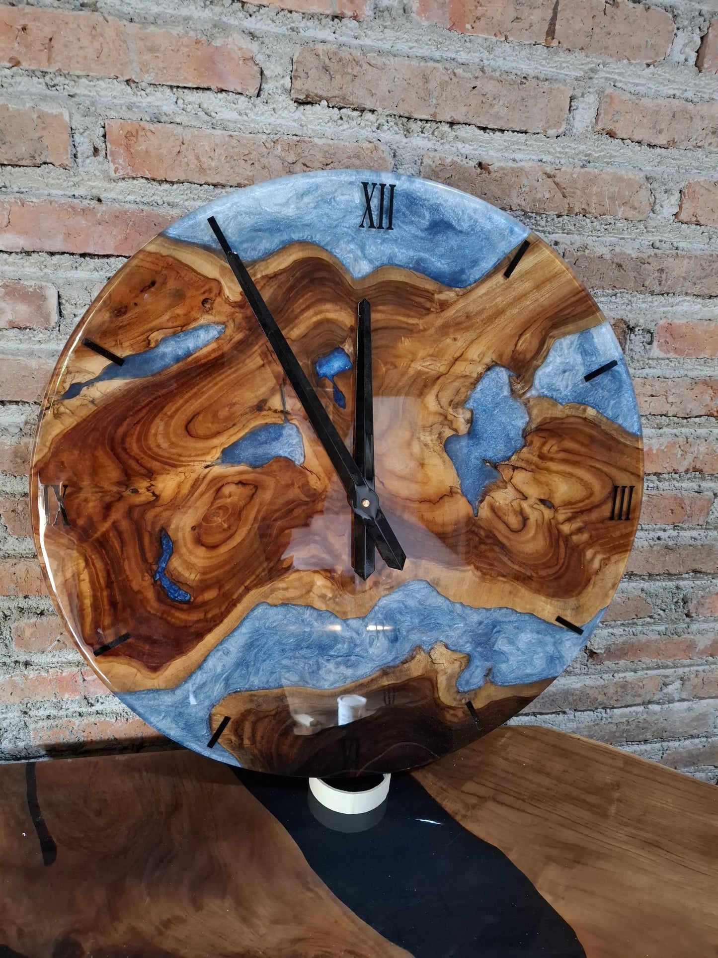 Eco-friendly handcrafted wooden wall clock with white resin accents and natural wood grain
