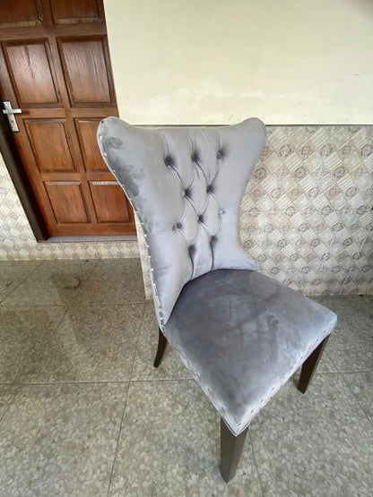 Luxury handcrafted dining chair with ergonomic design and velvet upholstered seat