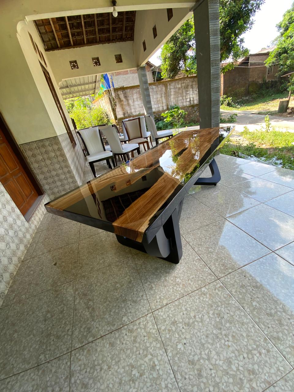 Luxury handcrafted teakwood dining table with glossy black resin river