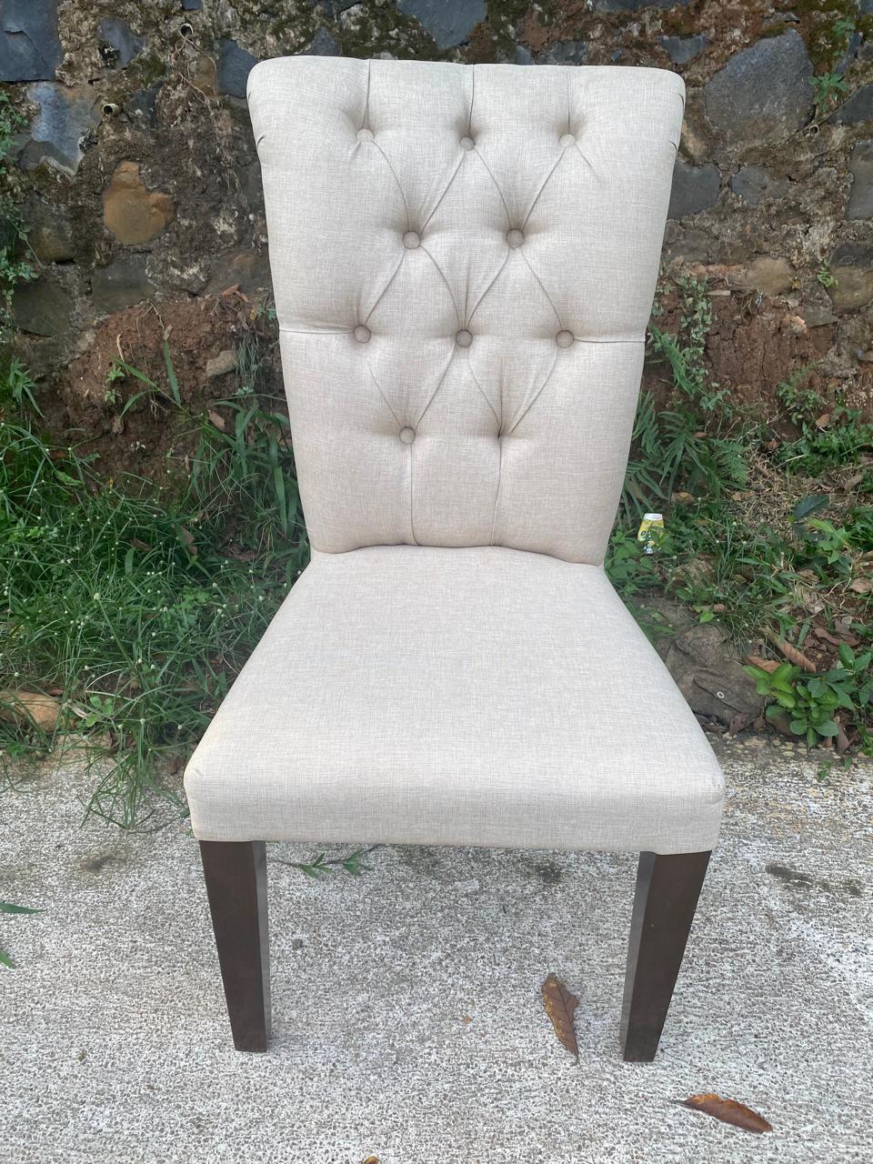 Luxury handcrafted teakwood dining chair with ergonomic design and upholstered seat