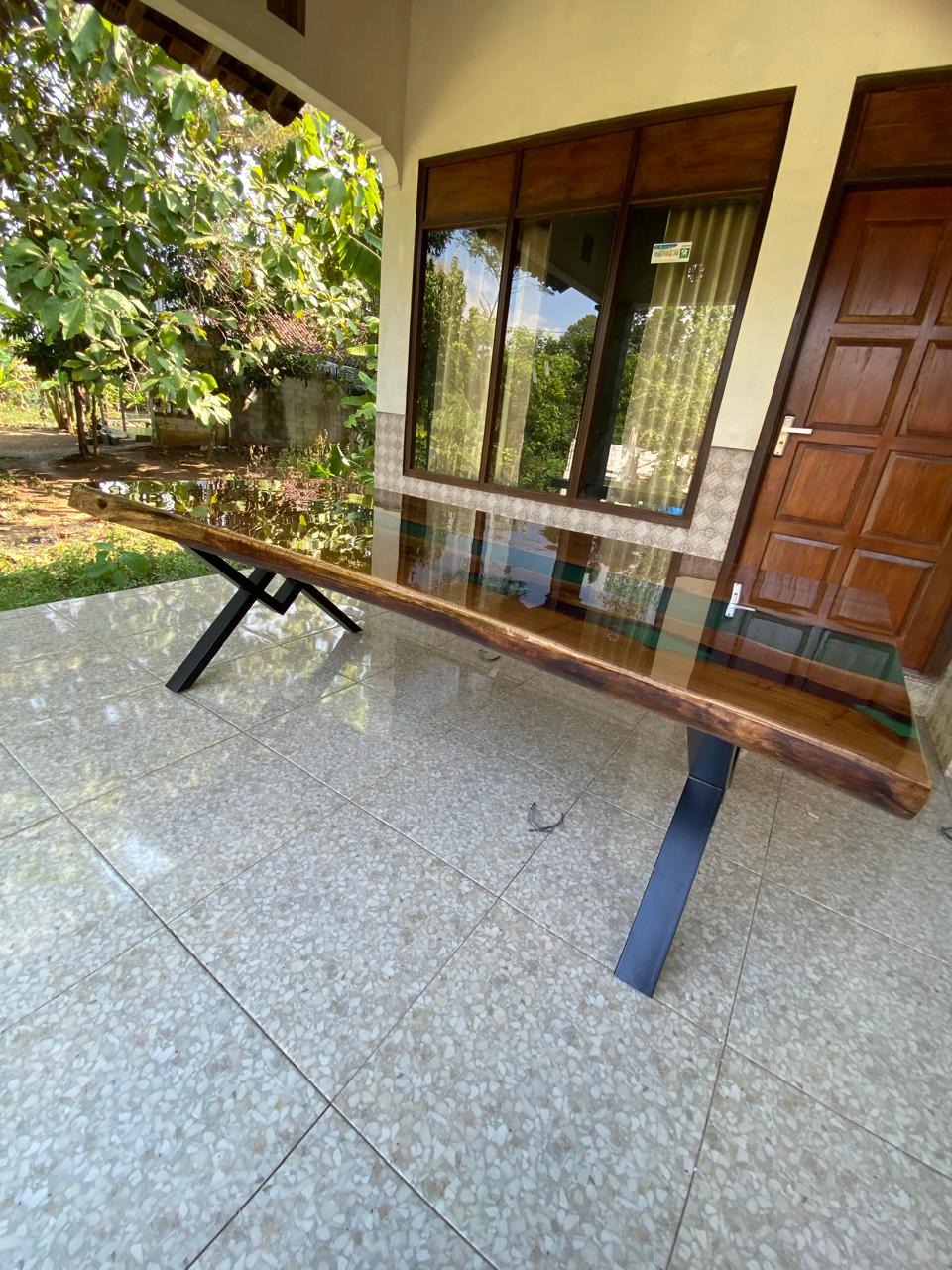 Luxury teakwood dining table with tranquil jade resin river and matte black steel legs