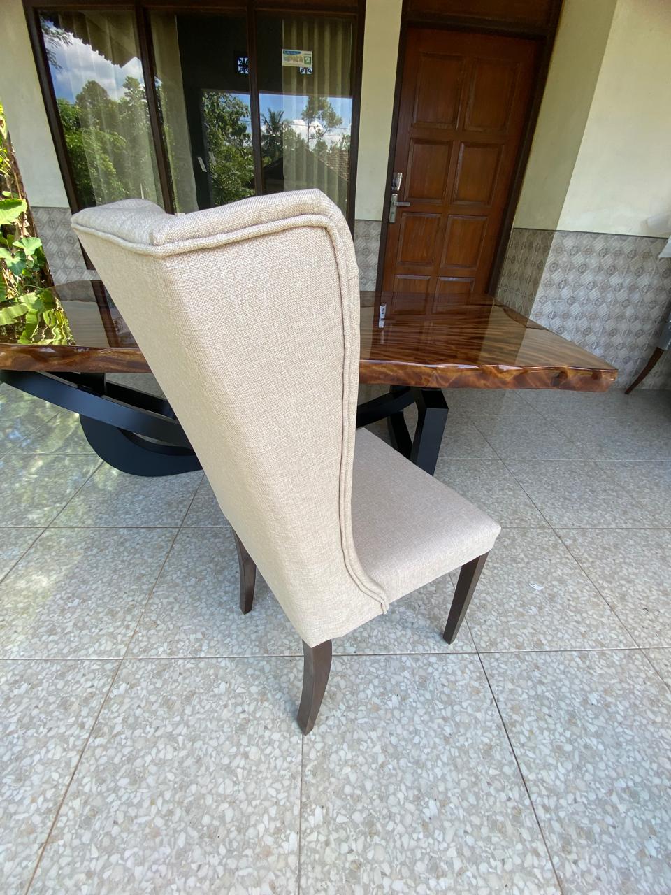 Luxury handcrafted dining chair with high backrest and cushioned seat