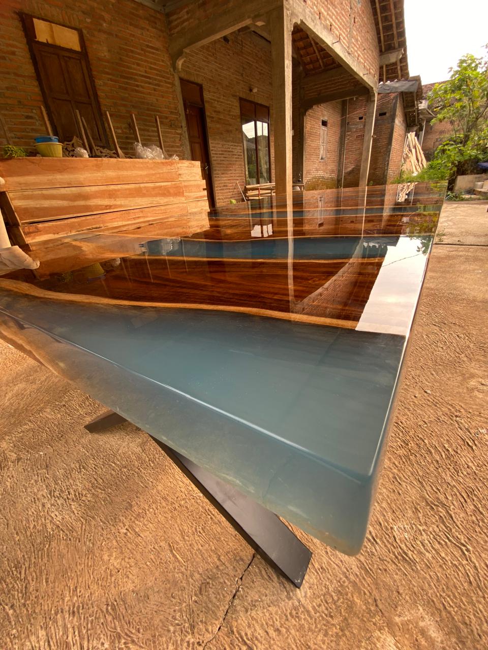 Unique handcrafted teakwood dining table with electric blue resin – sustainable luxury